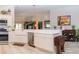 Modern kitchen with white cabinets, stainless steel appliances, and an open layout concept at 3466 Smedley Rd, The Villages, FL 32163