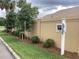 Well-manicured landscaping including trees, shrubs and grass at 3466 Smedley Rd, The Villages, FL 32163