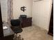 Functional office space with carpet, closet, dark wood desk, and sleek chair at 3466 Smedley Rd, The Villages, FL 32163