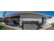 View of the outdoor patio with a hot tub and screened in lanai, perfect for relaxing at 3466 Smedley Rd, The Villages, FL 32163