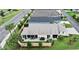 Aerial view of rear exterior with screened in lanai, patio and privacy wall at 3466 Smedley Rd, The Villages, FL 32163