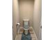 Compact half-bathroom with a modern toilet and wood-look tile flooring at 3466 Smedley Rd, The Villages, FL 32163