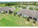 Community view with a well maintained lawn and enclosed screen porch at 3547 Fairwaters Ct # F, Clermont, FL 34711