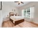 Bedroom with a Queen size bed, ceiling fan and light-colored walls at 3547 Fairwaters Ct # F, Clermont, FL 34711