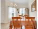 Cozy dining area with classic furnishings, a stylish chandelier, and plenty of natural light at 3547 Fairwaters Ct # F, Clermont, FL 34711