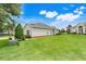 Well-manicured lawn complements this inviting single-story home in a peaceful neighborhood setting at 3547 Fairwaters Ct # F, Clermont, FL 34711