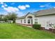 Single-story home with lush lawn, brick accents, and inviting entry exudes comfortable living at 3547 Fairwaters Ct # F, Clermont, FL 34711