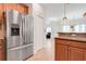 The kitchen features stainless steel appliances and ample counter space for meal preparation at 3547 Fairwaters Ct # F, Clermont, FL 34711