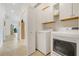 A functional laundry room with storage at 3547 Fairwaters Ct # F, Clermont, FL 34711