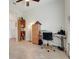 Corner office space with a bookshelf, desk, neutral paint, and tile floors at 3547 Fairwaters Ct # F, Clermont, FL 34711