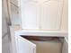 A storage cabinet is featured in the bathroom with a glass-enclosed shower nearby at 3555 Chapel Hill Blvd, Clermont, FL 34711