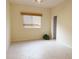 Light, airy bedroom with neutral walls, tile flooring, and a closet at 3555 Chapel Hill Blvd, Clermont, FL 34711