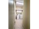 Well-lit laundry room including a washer, dryer, shelving and storage cabinets at 3555 Chapel Hill Blvd, Clermont, FL 34711
