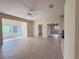 The open living space includes tile flooring, tan walls, and lots of natural light from the windows at 3555 Chapel Hill Blvd, Clermont, FL 34711