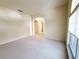 Bright living room with neutral carpet and natural light, offering a versatile space for relaxation and entertainment at 3555 Chapel Hill Blvd, Clermont, FL 34711