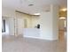A bright living area features neutral tile flooring and access to various rooms throughout the house at 3555 Chapel Hill Blvd, Clermont, FL 34711