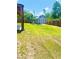 Large fenced backyard with green grass and storage shed at 4002 Sw 158Th Street Rd, Ocala, FL 34473