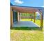 Outdoor patio with wooden pergola overlooking a spacious backyard at 4002 Sw 158Th Street Rd, Ocala, FL 34473