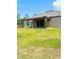 Enjoy outdoor living on this covered patio with access to a lush, green backyard at 4002 Sw 158Th Street Rd, Ocala, FL 34473
