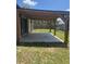 Outdoor patio with wooden pergola overlooking a spacious backyard at 4002 Sw 158Th Street Rd, Ocala, FL 34473