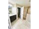 Bright bathroom featuring tile flooring, a granite-topped vanity, toilet room, and a walk-in shower at 4002 Sw 158Th Street Rd, Ocala, FL 34473