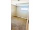 Clean, neutral bedroom with carpet flooring and a single window at 4002 Sw 158Th Street Rd, Ocala, FL 34473