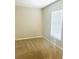 Neutral bedroom featuring carpet floors and window with blinds at 4002 Sw 158Th Street Rd, Ocala, FL 34473