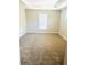 Cozy bedroom with natural light, carpet, and neutral paint at 4002 Sw 158Th Street Rd, Ocala, FL 34473