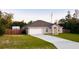 Single-story home features a private backyard, attached two-car garage and lengthy driveway at 4002 Sw 158Th Street Rd, Ocala, FL 34473