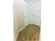 Hallway with neutral-colored carpet and multiple white doors at 4002 Sw 158Th Street Rd, Ocala, FL 34473