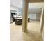 View of an open kitchen with a center island, stainless steel appliances, and tile flooring at 4002 Sw 158Th Street Rd, Ocala, FL 34473