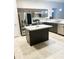 Modern kitchen featuring stainless steel appliances, a center island, and sleek countertops at 4002 Sw 158Th Street Rd, Ocala, FL 34473
