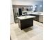 Modern kitchen with stainless steel appliances and center island at 4002 Sw 158Th Street Rd, Ocala, FL 34473