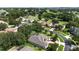 Aerial view showcasing a home near a golf course in a lovely community with verdant landscapes at 4239 Fawn Meadows Cir, Clermont, FL 34711