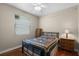 Cozy bedroom with a window, hardwood floors, and natural light at 4239 Fawn Meadows Cir, Clermont, FL 34711