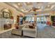 Clubhouse interior with fireplace, comfortable seating, and elegant decor at 4239 Fawn Meadows Cir, Clermont, FL 34711