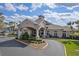 Elegant building entrance and porte-cochere welcomes you home at 4239 Fawn Meadows Cir, Clermont, FL 34711