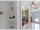 Inviting foyer featuring decorative niches, tile flooring, and an elegant dining room view at 4239 Fawn Meadows Cir, Clermont, FL 34711