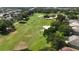 Picturesque golf course view featuring lush fairways and mature trees in a serene setting at 4239 Fawn Meadows Cir, Clermont, FL 34711