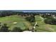 Scenic golf course view with trees and water hazards in a beautiful residential community at 4239 Fawn Meadows Cir, Clermont, FL 34711