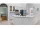Stylish kitchen features white cabinets, stainless appliances, and a white countertop island at 4239 Fawn Meadows Cir, Clermont, FL 34711
