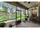 Screened porch with a view of the backyard, play set, and lush landscaping at 4239 Fawn Meadows Cir, Clermont, FL 34711