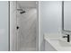 Elegant bathroom showcasing a glass enclosed shower with stylish tile and black fixtures at 472 Malauka Radl, Ocklawaha, FL 32179
