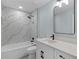 Stylish bathroom features a tub, shower, and elegant vanity at 472 Malauka Radl, Ocklawaha, FL 32179