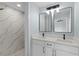 Beautiful bathroom featuring double sinks, modern fixtures, and a tiled shower at 472 Malauka Radl, Ocklawaha, FL 32179
