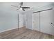 Neutral bedroom offering fan, closet and en suite access at 472 Malauka Radl, Ocklawaha, FL 32179