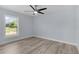 Bright bedroom with hardwood floors and a ceiling fan at 472 Malauka Radl, Ocklawaha, FL 32179