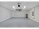 Clean and spacious garage with ample lighting and an electrical panel at 472 Malauka Radl, Ocklawaha, FL 32179