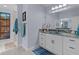 Stylish bathroom with a vanity, framed mirror, and designer accents at 4878 Chitty Chatty Run, The Villages, FL 32163