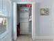 Organized bedroom closet with built-in shelving and drawers at 4878 Chitty Chatty Run, The Villages, FL 32163